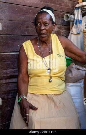 Woman Attending Afro-Cuban pig killing ceremony according to the Santería religion, Matanzas, Cuba Stock Photo