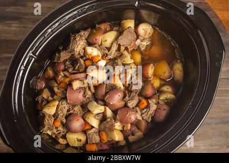 Crock Pot Beef Stew with carrots, potatoes, lean stewing beef in a rich