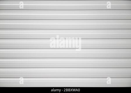 Garage slide roller shutter door stripped texture, metal background. Stock Photo