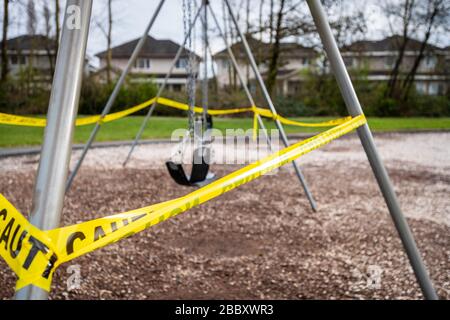 Surrey, Canada - Mar 29, 2020: Swings and playground closed due to Coronavirus Covid-19 pandemic Stock Photo