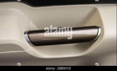 Close up the door handles inside the car Stock Photo
