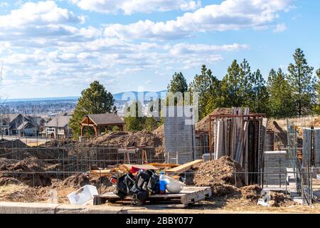 An abandoned new home construction job site in a hillside subdivision near Spokane Washington, USA. Stock Photo