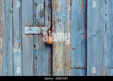 new lock on old wooden door Stock Photo