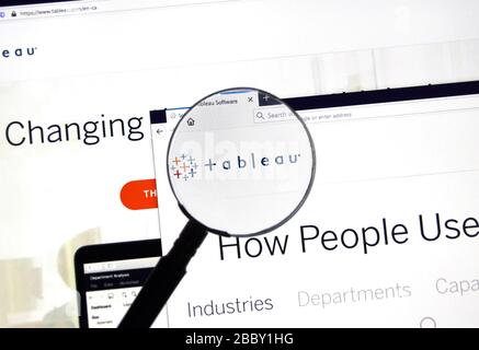 Montreal, Canada - March 08, 2020: Tableau official web site and logo under magnifying glass. Tableau Software is an American interactive data visuali Stock Photo