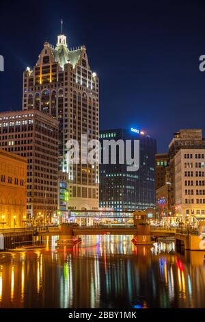 Downtown Milwaukee reflected in the Milwaukee River at night, Milwaukee, Wisconsin Stock Photo