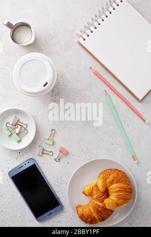 Light and bright tabletop with a smartphone Stock Photo
