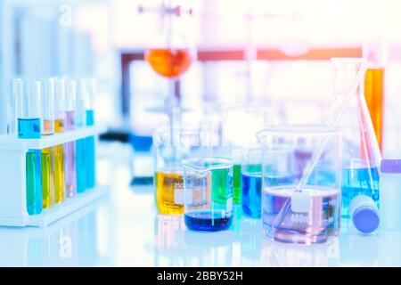 Glass flask in Science Chemical laboratory or Medical research lab with colorful liquid for background