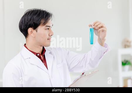 Scientist happy proudly to successful discover new drug formula best work in medical science lab Stock Photo