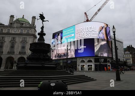 London, London, UK. 1st Apr, 2020. Part of the advertising board at Piccadilly Circus displays a 'thank you' message to medical workers, in London, Britain on April 1, 2020. The number of confirmed cases of COVID-19 in Britain reached 29,474 as of Wednesday morning, an increase of 4,324 in 24 hours, according to the Department of Health and Social Care. Credit: Tim Ireland/Xinhua/Alamy Live News Stock Photo