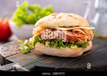 Fresh and healthy pesto turkey sandwich Stock Photo