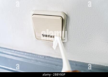 Man Using Contactless Tool To Press Button To Protect From Coronavirus Infection Stock Photo