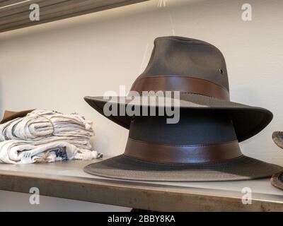Stack of two fedora hats on display in department store clothes section Stock Photo