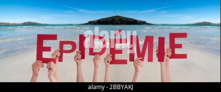 People Hands Holding Word Epidemie Means Epidemic, Ocean Background Stock Photo