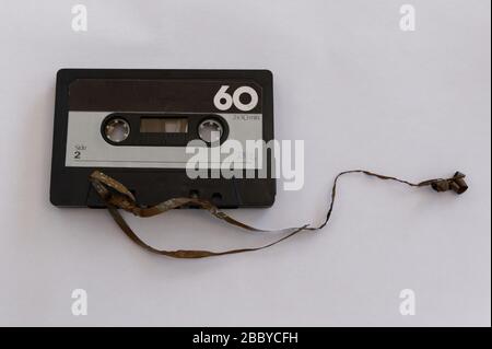 A cassette tape has its tape broken Stock Photo