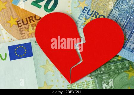 Broken heart on euro banknote - Concept of love and money relationship Stock Photo