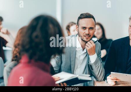 close up. brooding entrepreneur sitting at office Desk Stock Photo