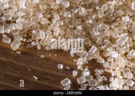 Macro shot of brown sugar on a wooden table Stock Photo