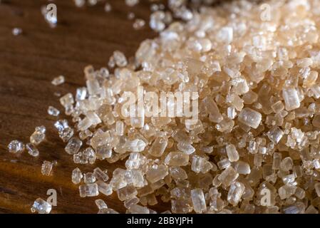 Macro shot of brown sugar on a wooden table Stock Photo