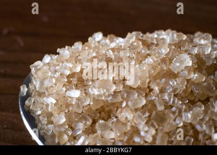 Macro shot of brown sugar on a wooden table Stock Photo