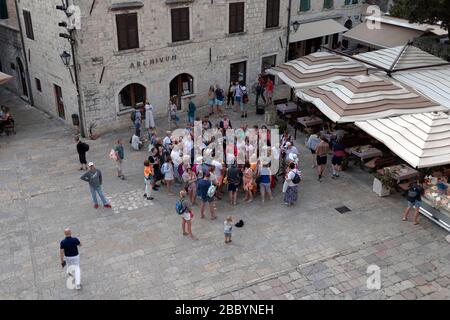 Montenegro, Sep 22, 2019: A large group of tourists at the Saint Tryphon Square in Kotor Old Town Stock Photo