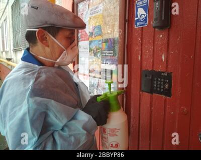 02.04.2020 Moscow. Russia. Daily disinfection of the entrance of an apartment building from the coronavirus. Stock Photo