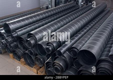 Steel pipes for ventilation system. Ventilation ducts components Construction equipment. Stock Photo