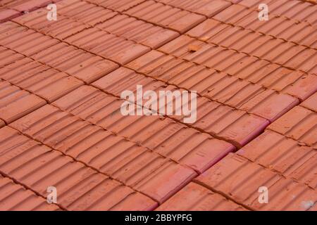 A stack of new red clay bricks for new construction Stock Photo