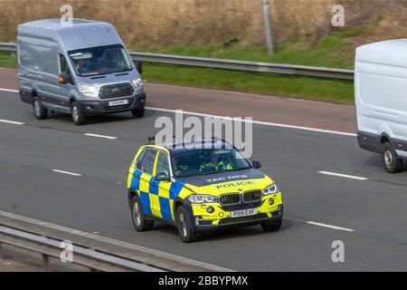 Tac ops, Lancashire Tactical Operations division. UK Police Vehicular traffic, transport, modern, BMW saloon cars, north-bound on the 3 lane M6 motorway highway. Stock Photo