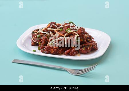 Paneer Tikka Kabab in red sauce-is an Indian dish made from chunks of cottage cheese marinated in spices,chilli Paneer Kabab,Paneer 65,Spicy cottage Stock Photo