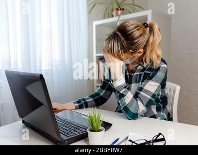 A pretty woman is worried about work, she is irritable and sad Stock Photo