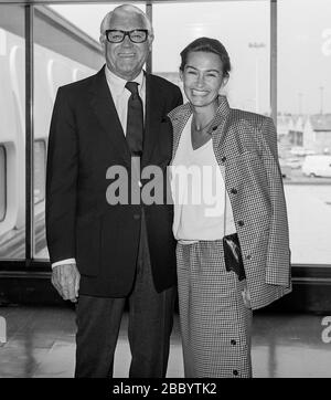 American actor Carrie Grant and his wife Barbara arriving at London's Heathrow Airport in 1983. Stock Photo