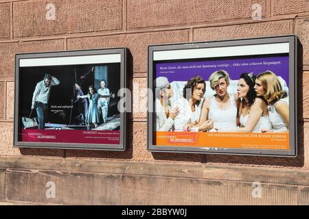 NUREMBERG, GERMANY - MAY 7, 2018: Poster promoting theater play in Staatstheater Nurnberg (State Theater of Nuremberg) in Germany. The theater opened Stock Photo