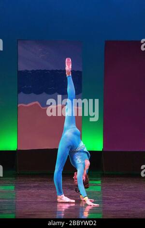 Ballet dancer performing as the caterpillar in Alice in Wonderland Stock Photo