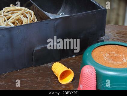 Rubber bands, container, Paper clips, finger rubbers moisture pad. The Brookfields Post Office, recreating a provincil post office counter of the 1960 Stock Photo