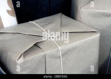 Parcels wrapped in brown paper and tied with string The Brookfields Post Office, recreating a provincil post office counter of the 1960's Stock Photo