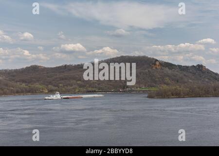 A barge on the Mississippi River during spring. Stock Photo