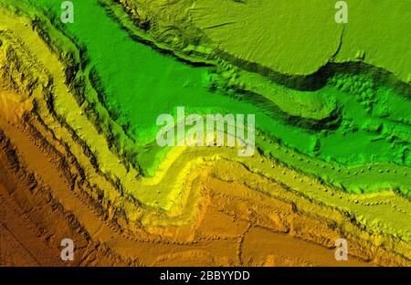 DEM - digital elevation model. Gis product made after proccesing pictures taken from a drone. It shows excavation site with steep rock walls Stock Photo