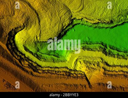 DEM - digital elevation model. Gis product made after proccesing pictures taken from a drone. It shows excavation site with steep rock walls Stock Photo