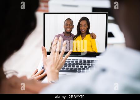 High Angle View Of Young Couple Using Digital Tablet Together At Home Stock Photo