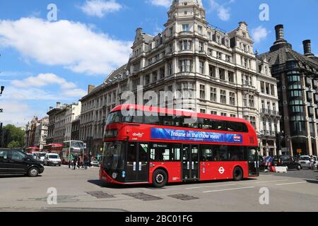 LONDON, UK - JULY 7, 2016: New Routemaster buses in Westminster, London. The hybrid diesel-electric bus is a new, modern version of iconic double deck Stock Photo