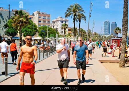 BARCELONA, SPAIN - MAY 28: A crowd of people walking in the seafront of La Barceloneta on May 28, 2015 in Barcelona, Spain. The city has a long and bu Stock Photo