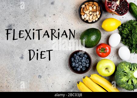 Flexitarian Diet Concept. Vegetables, fruits and bean product on light stone table background. Top view, flat lay, copy space Stock Photo