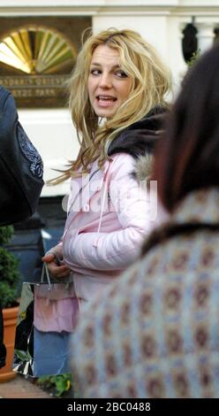 25 October 2005. Britney Spears surfaces outside the rear exit of her London Mandarin Oriental Hotel in Hyde Park early this morning at around 8am, after a night out  at Rex Cinema and Bar in London's Soho, reportedly drinking Vodka and tonic and Champagne into the early hours. It looks like Britney has missed her alarm call and forgot to brush her hair! She is certainly going to need that extra hour in bed tonight as the clocks go back! Picture by Tony Henshaw Stock Photo