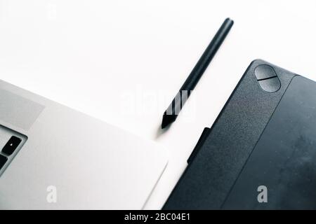 Workspace of a designer with a graphics tablet, stylus and computer Stock Photo