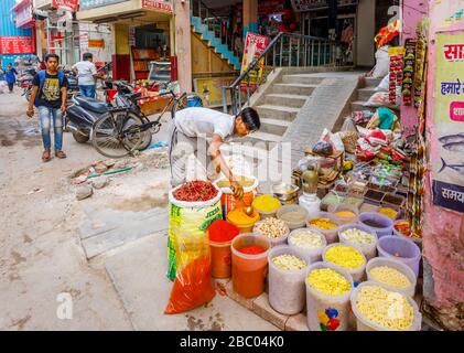 Colourful spices and dried vegetables on display: street scene in Mahipalpur district, a suburb near Delhi Airport in New Delhi, capital city of India Stock Photo