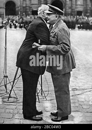 Churchill being greeted by the French P.M. Paul Ramadier, on being presented with the Medaille Militaire at Les Invalides. Paris, 10th May 1947 Stock Photo