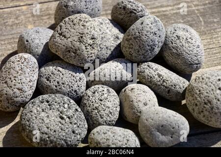 group of round lava stones, small nature lava rocks background Stock Photo