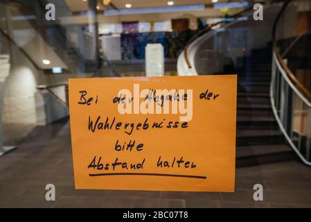 Local elections 2020 under the sign of the corona virus: in the picture, election workers in Ottobrunn town hall are asked to keep their distance when handing in the election results. [automated translation] Stock Photo