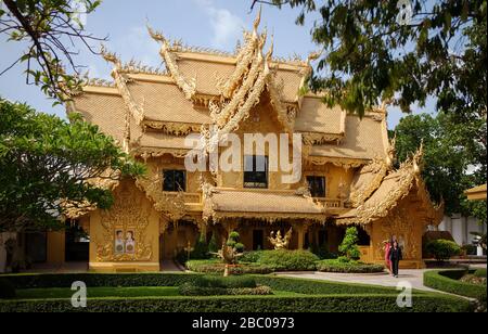 Golden toalet at White Temple's area (Wat Rong Khun) situated near by Chiang Rai. It is one of Thailand's most beautiful temples in Northern Thailand. Stock Photo