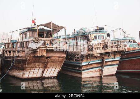 Old wooden boats at Abra docks in Dubai Creek Stock Photo